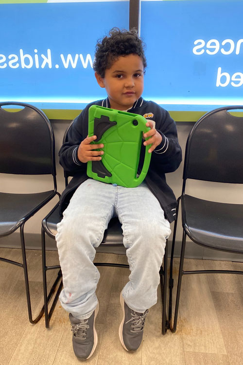 Miles in a waiting room chair