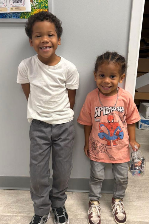 patient siblings leaning up against the wall